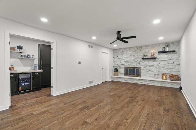 22308 S Eastcliff Dr, Joliet, IL 60404 - unfurnished living room featuring beverage cooler, a ceiling fan, bar, a fireplace, and recessed lighting