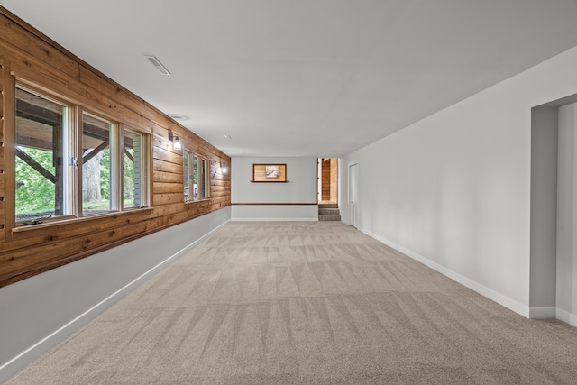 22308 S Eastcliff Dr, Joliet, IL 60404 - empty room featuring wooden walls and carpet floors