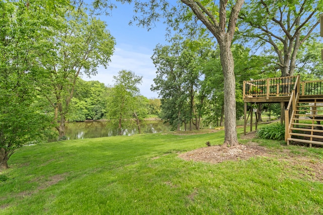 22308 S Eastcliff Dr, Joliet, IL 60404 - view of grassy yard with stairway and a deck with water view