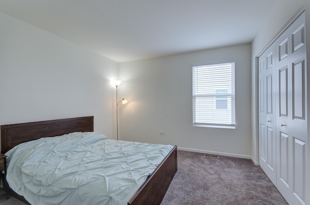 208 Cooper St, Plano, IL 60545 - carpeted bedroom featuring a closet and baseboards