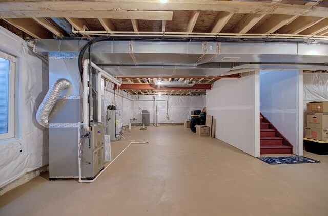 208 Cooper St, Plano, IL 60545 - unfinished basement with gas water heater, heating unit, and stairway