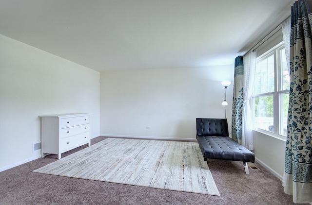 208 Cooper St, Plano, IL 60545 - sitting room with healthy amount of natural light, carpet flooring, and baseboards