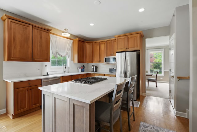 3404 Royal Woods Dr, Crystal Lake, IL 60014 - kitchen featuring appliances with stainless steel finishes, light wood-style floors, plenty of natural light, and recessed lighting