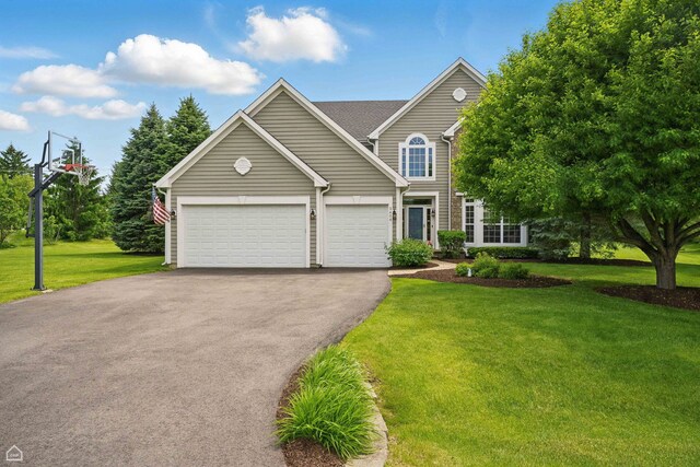 3404 Royal Woods Dr, Crystal Lake, IL 60014 - traditional home with asphalt driveway, a front lawn, and a garage