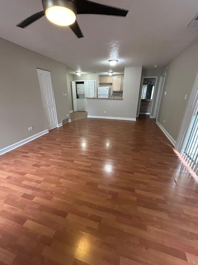 2044 N Rand Rd Unit 107, Palatine, IL 60074 - unfurnished living room featuring ceiling fan, light wood-type flooring, and baseboards
