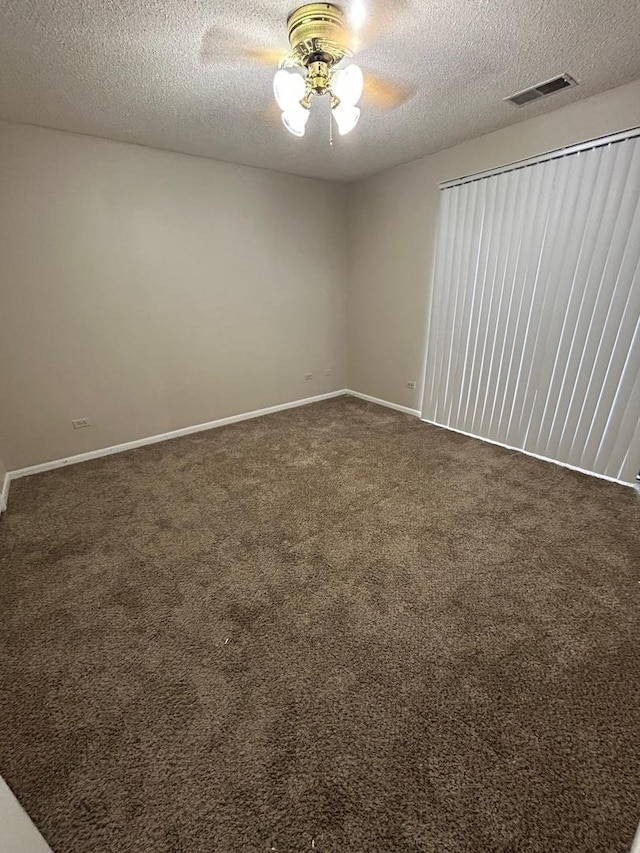 2044 N Rand Rd Unit 107, Palatine, IL 60074 - empty room featuring dark colored carpet, a ceiling fan, a textured ceiling, and baseboards
