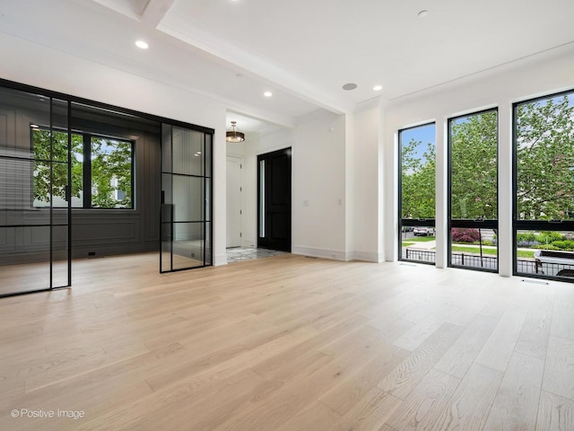 1853 W Barry Ave, Chicago, IL 60657 - empty room with beam ceiling, light wood-style flooring, baseboards, and recessed lighting