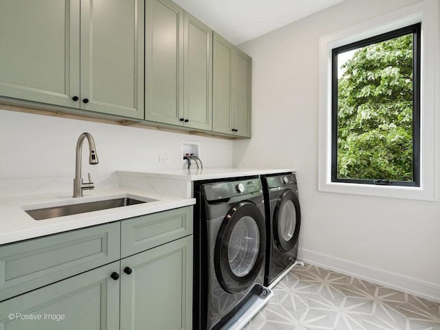 1853 W Barry Ave, Chicago, IL 60657 - washroom featuring cabinet space, washer and clothes dryer, and baseboards