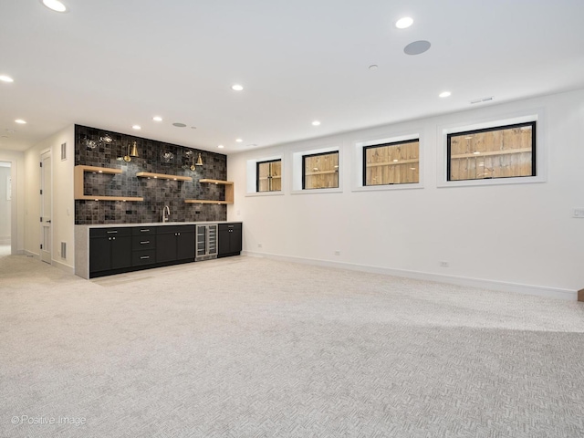 1853 W Barry Ave, Chicago, IL 60657 - indoor wet bar featuring light colored carpet, baseboards, recessed lighting, decorative backsplash, and beverage cooler