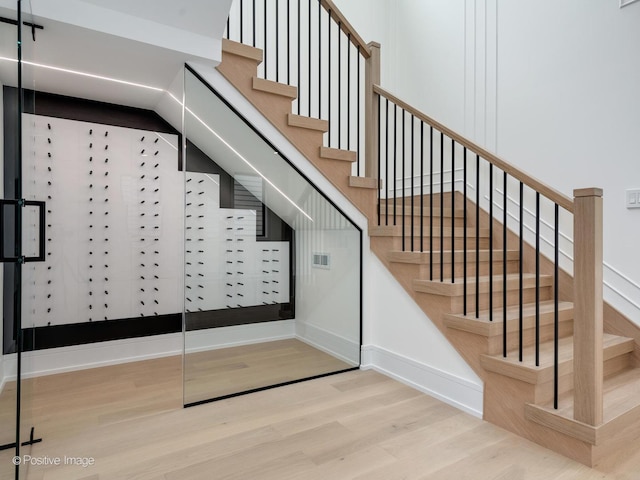 1853 W Barry Ave, Chicago, IL 60657 - stairs with wood finished floors and baseboards