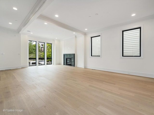 1853 W Barry Ave, Chicago, IL 60657 - unfurnished living room with light wood-type flooring, a tiled fireplace, baseboards, ornamental molding, and recessed lighting