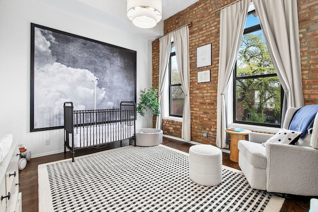 1014 N Milwaukee Ave Unit 2, Chicago, IL 60642 - foyer featuring wood finished floors, brick wall, and baseboards