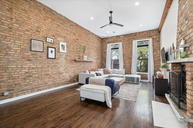 1014 N Milwaukee Ave Unit 2, Chicago, IL 60642 - living room featuring ceiling fan, a brick fireplace, dark wood-type flooring, brick wall, and recessed lighting