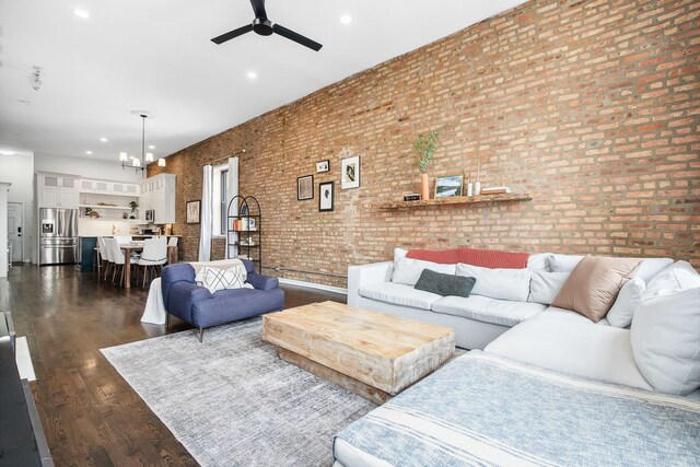 1014 N Milwaukee Ave Unit 2, Chicago, IL 60642 - living room featuring a ceiling fan, dark wood-type flooring, recessed lighting, brick wall, and a chandelier