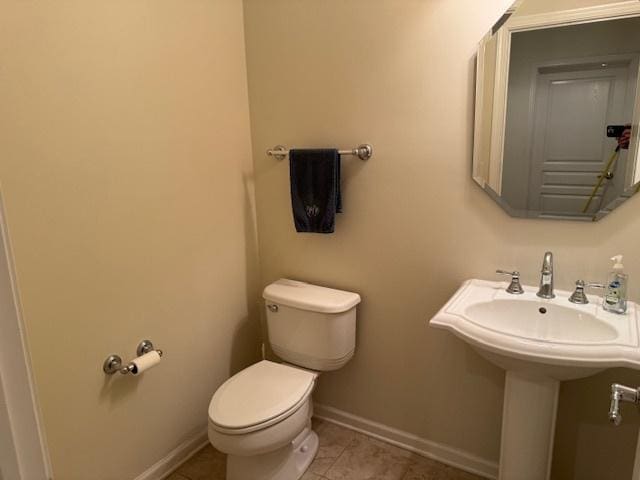 3881 Melody St, Mundelein, IL 60060 - bathroom featuring toilet, baseboards, and tile patterned floors