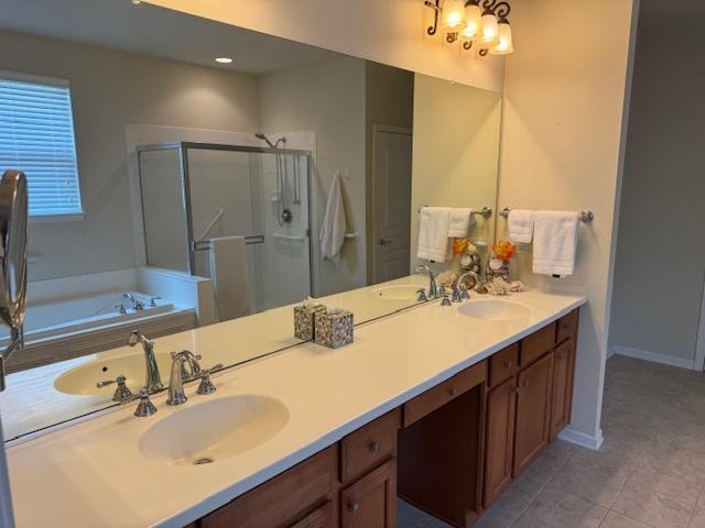 3881 Melody St, Mundelein, IL 60060 - bathroom with a stall shower, double vanity, a bath, tile patterned floors, and baseboards