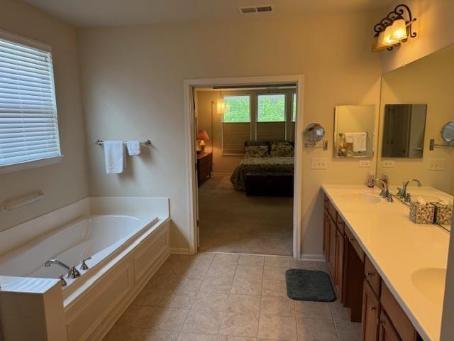 3881 Melody St, Mundelein, IL 60060 - bathroom featuring ensuite bath, double vanity, a garden tub, tile patterned floors, and baseboards
