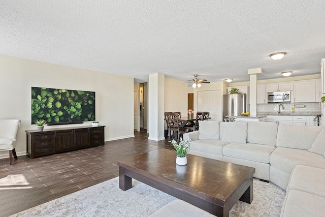 2211 S Highland Ave Unit 1B, Lombard, IL 60148 - living area featuring ceiling fan, wood finish floors, a textured ceiling, and baseboards
