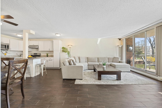2211 S Highland Ave Unit 1B, Lombard, IL 60148 - living area with a textured ceiling, ceiling fan, and wood tiled floors