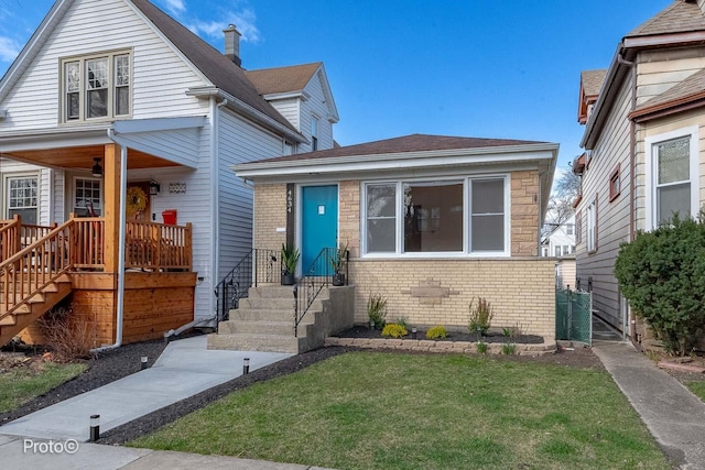 4634 N Hamlin Ave, Chicago, IL 60625 - view of front of house featuring a front yard and brick siding