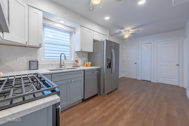 4634 N Hamlin Ave, Chicago, IL 60625 - kitchen featuring dishwashing machine, ceiling fan, a sink, gas range, and stainless steel fridge with ice dispenser