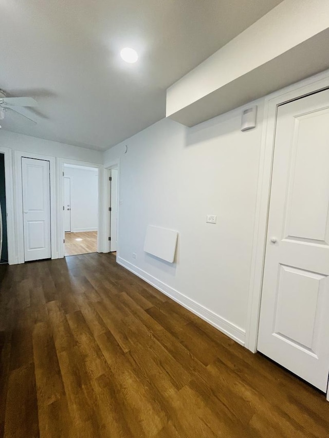 4634 N Hamlin Ave, Chicago, IL 60625 - spare room with baseboards, dark wood-style flooring, and ceiling fan