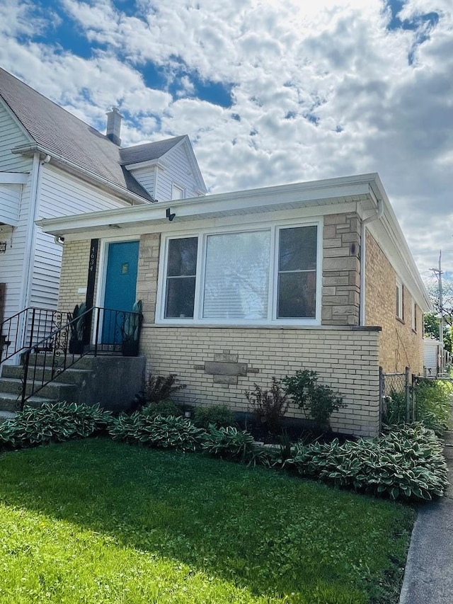 4634 N Hamlin Ave, Chicago, IL 60625 - view of front of home with brick siding and a front lawn