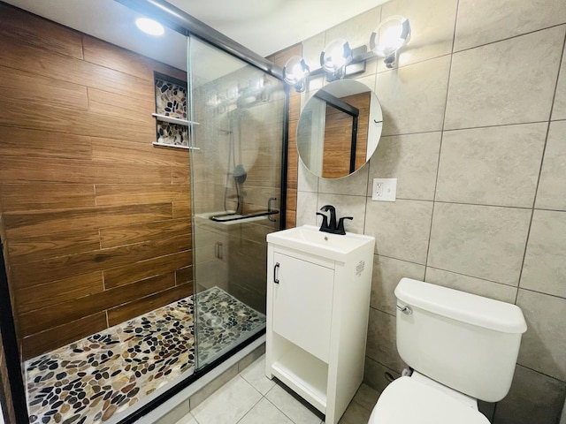 4634 N Hamlin Ave, Chicago, IL 60625 - full bath featuring toilet, vanity, a stall shower, tile walls, and tile patterned flooring