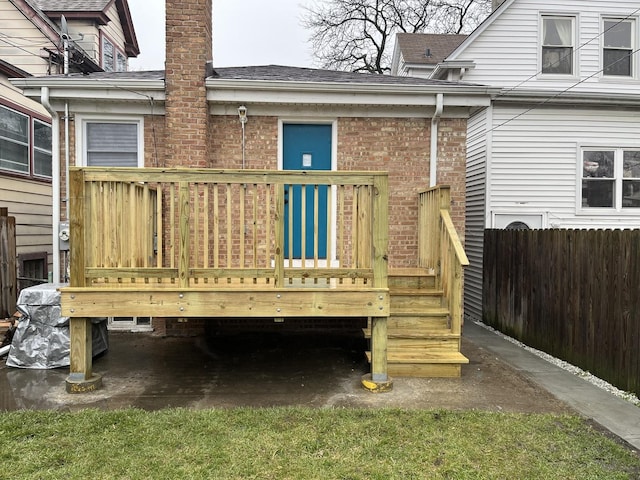 4634 N Hamlin Ave, Chicago, IL 60625 - back of property with a deck, a shingled roof, brick siding, and a chimney