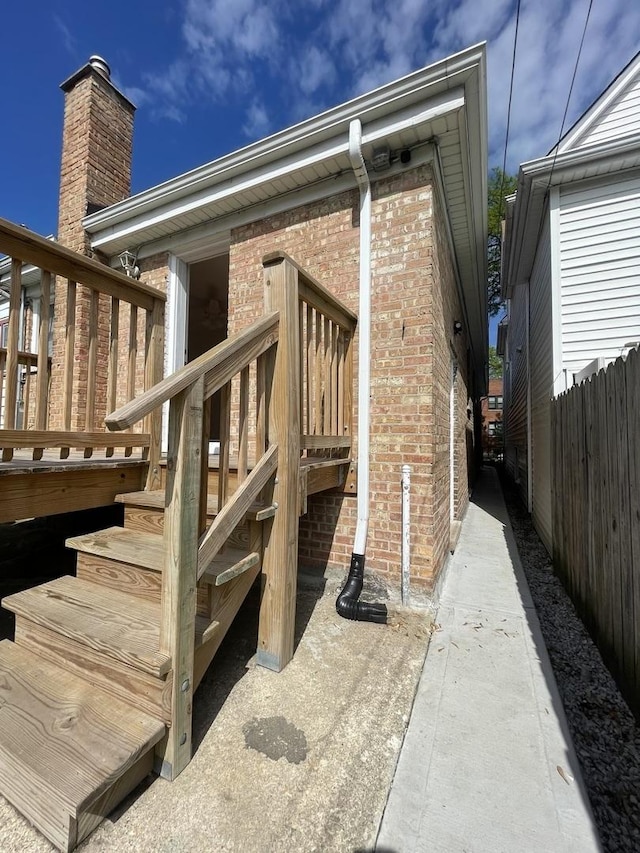 4634 N Hamlin Ave, Chicago, IL 60625 - entrance to property with brick siding and a wooden deck
