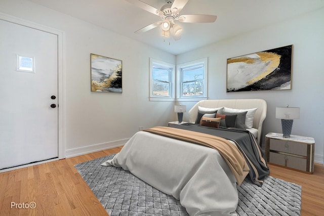 4634 N Hamlin Ave, Chicago, IL 60625 - bedroom with light wood finished floors, baseboards, and a ceiling fan