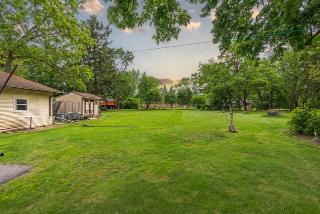 408 Manhattan Rd, Joliet, IL 60433 - yard at dusk featuring view of scattered trees and a lawn
