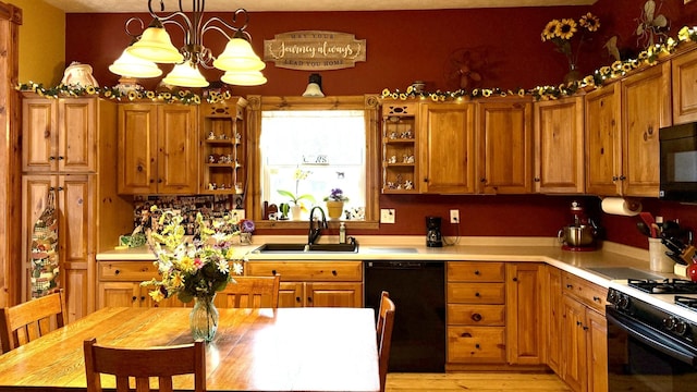 403 E Hickory St, Fairbury, IL 61739 - kitchen with black appliances, a sink, open shelves, and light countertops