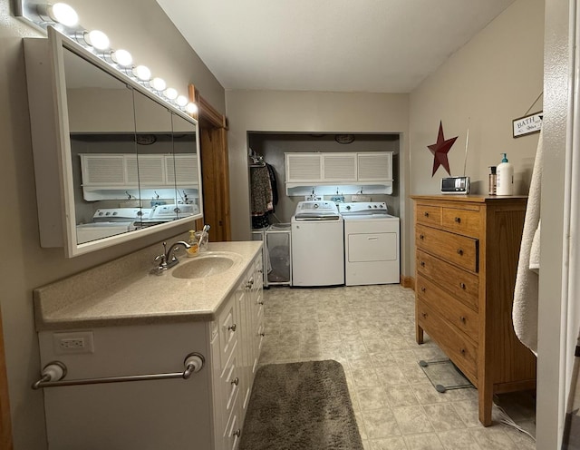 403 E Hickory St, Fairbury, IL 61739 - bathroom with independent washer and dryer, vanity, and tile patterned floors