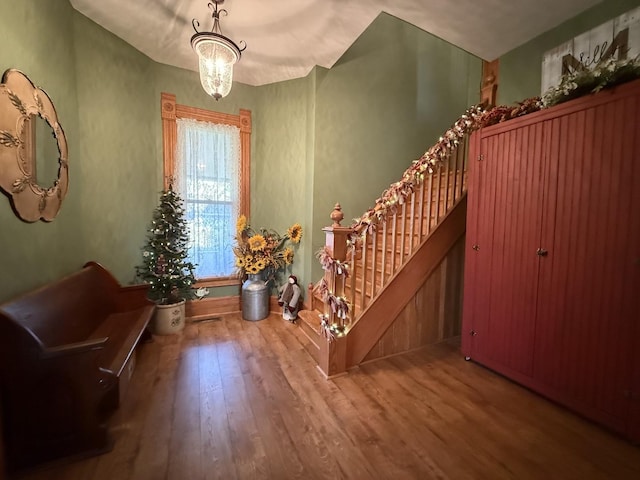 403 E Hickory St, Fairbury, IL 61739 - entryway with wood finished floors, a chandelier, stairway, and baseboards