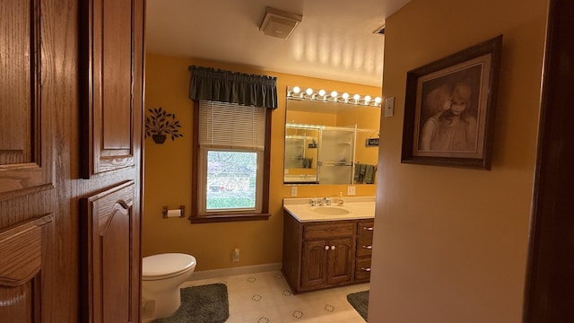 403 E Hickory St, Fairbury, IL 61739 - full bath with toilet, vanity, a stall shower, and baseboards