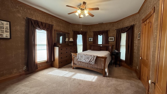 403 E Hickory St, Fairbury, IL 61739 - bedroom with light colored carpet, crown molding, wallpapered walls, baseboards, and ceiling fan