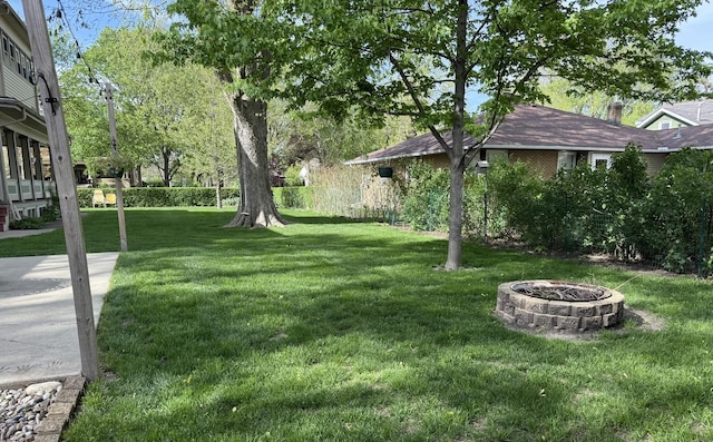 403 E Hickory St, Fairbury, IL 61739 - view of grassy yard with a fire pit
