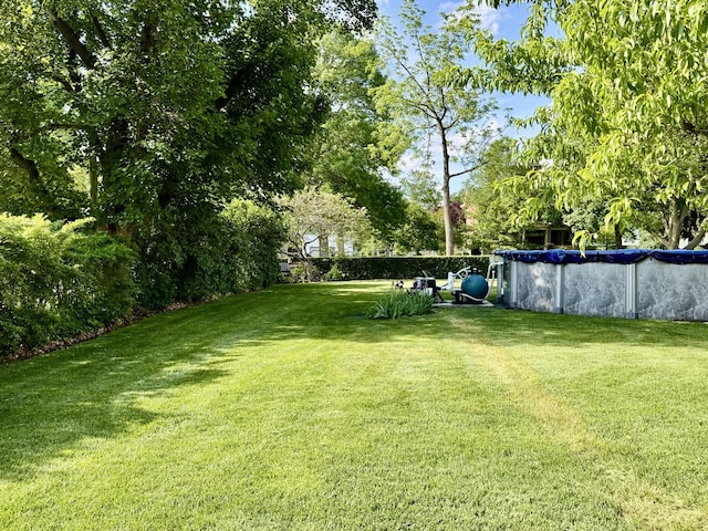 403 E Hickory St, Fairbury, IL 61739 - view of grassy yard with a covered pool