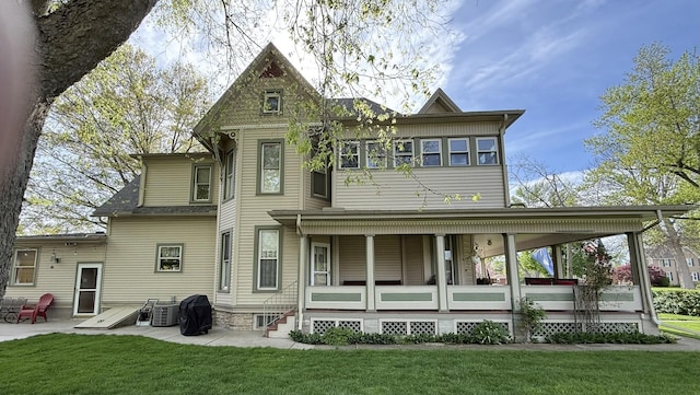 403 E Hickory St, Fairbury, IL 61739 - back of house with a lawn, a porch, and a patio
