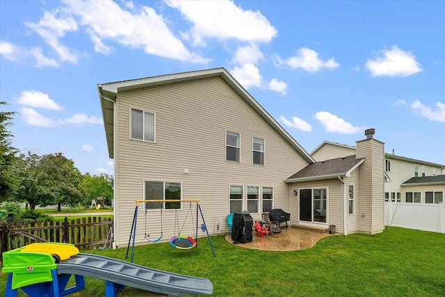 1508 Parkside Dr, Plainfield, IL 60586 - back of house with a playground and a patio