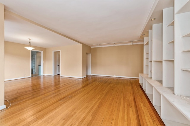 5555 N Sheridan Rd Unit 308, Chicago, IL 60640 - unfurnished living room with light wood-type flooring and baseboards