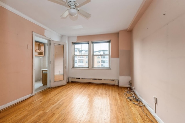 5555 N Sheridan Rd Unit 308, Chicago, IL 60640 - unfurnished bedroom featuring a baseboard radiator, light wood-style floors, baseboards, and ceiling fan