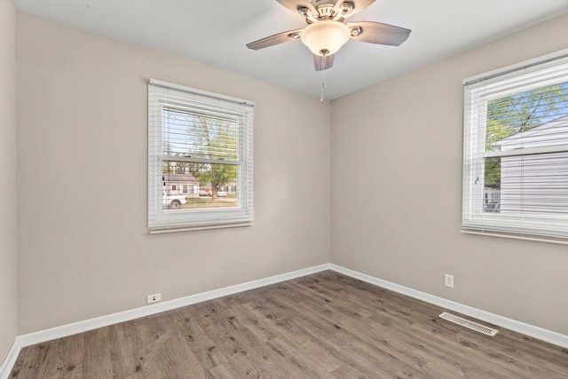 1011 Cypress Ln, Joliet, IL 60435 - empty room with wood finished floors and a ceiling fan