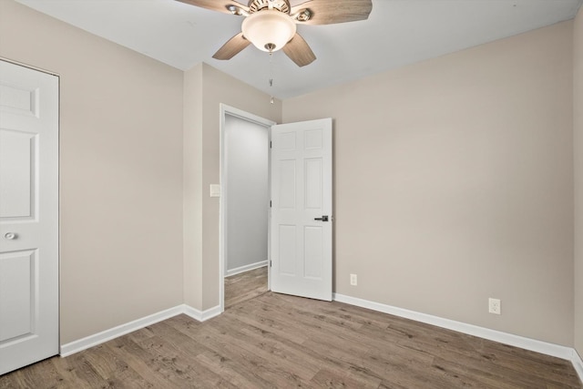 1011 Cypress Ln, Joliet, IL 60435 - unfurnished bedroom featuring wood finished floors and a ceiling fan