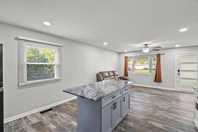 1011 Cypress Ln, Joliet, IL 60435 - kitchen with recessed lighting, gray cabinetry, a ceiling fan, light stone counters, and dark wood-style floors
