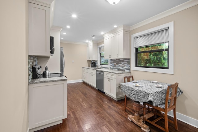 1000 Meadow Rd, Northbrook, IL 60062 - kitchen featuring stainless steel appliances, crown molding, tasteful backsplash, recessed lighting, and dark wood-type flooring
