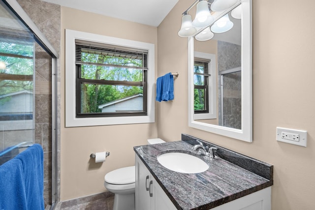 1000 Meadow Rd, Northbrook, IL 60062 - full bathroom with vanity, a stall shower, toilet, and baseboards