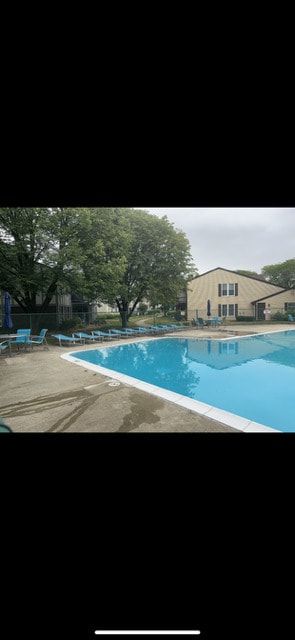 2165 Sunderland Ct Unit 101A, Naperville, IL 60565 - community pool featuring a patio