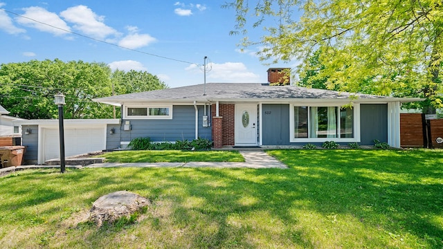 522 Division St, Pecatonica, IL 61063 - view of front facade featuring a chimney and a garage